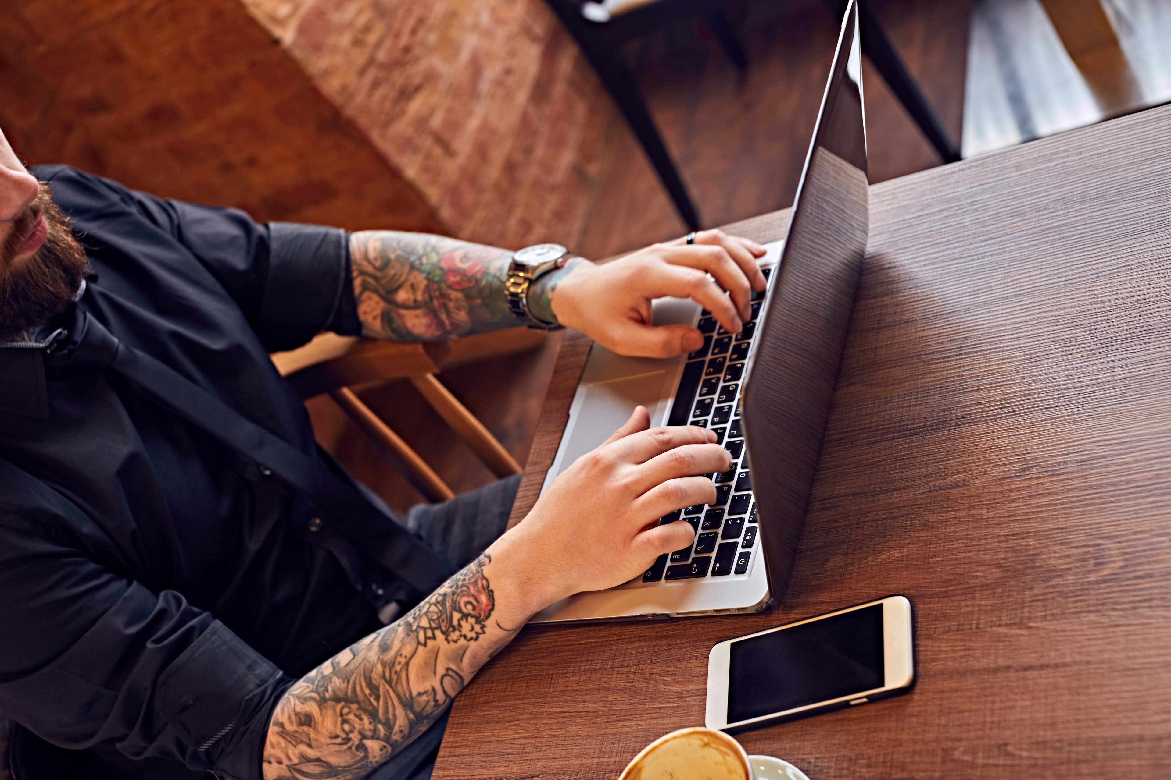 Image of a man working a laptop